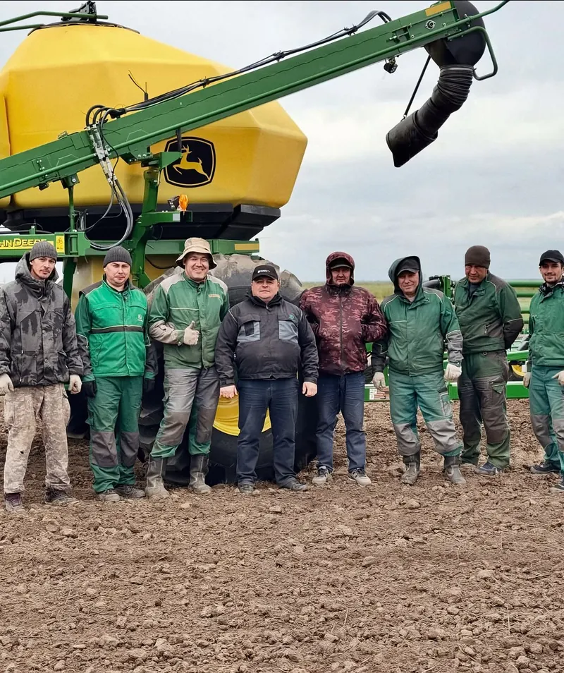 The Agro-Astra team with a John Deere seeder